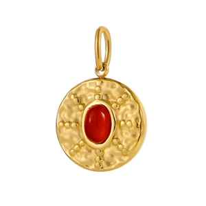 Detailed macro shot of vintage gold round pendant with a vibrant red oval stone inlay