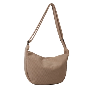 Minimalist light brown corduroy crescent crossbody bag with adjustable shoulder strap