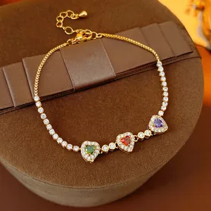 18k gold plated tennis chain bracelet with three colorful heart-shaped zirconia stones