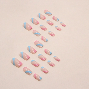 Long square press-on nails featuring blue and pink wavy curves on a nude base