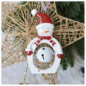 Close-up of resin snowman ornament with hollow star bell and festive red scarf details