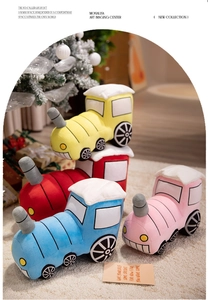 Set of four colorful cartoon train plush toys in red, yellow, blue, and pink colors
