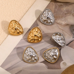 Irregular triangular stud earrings with hammered texture in gold and silver finish