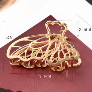 Detailed view of golden butterfly hair claw clip with size measurements 7.8cm and 5cm