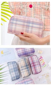 Detail of multi-color plaid pencil case with high capacity and double zipper design