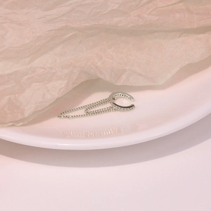 Detail of silver S925 sterling silver ear cuff with double chains and small crystals