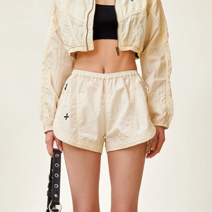 Women's beige crinkled nylon streetwear set with cropped zip jacket and running shorts