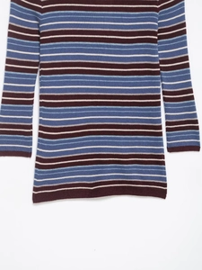 Detailed view of the multicolor horizontal striped knit texture and fine ribbed fabric