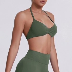 Detail of army green halter yoga bra and leggings set with ribbed texture and slim fit