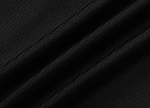 Vue macro d'un tissu noir côtelé de haute qualité montrant une texture fine et élégante