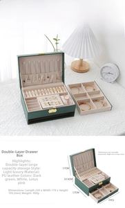 Green leather jewelry box with two drawers, necklace hooks and ring slots, 23x17x10.5cm