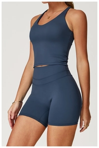Detail view of dark blue-grey yoga set featuring high-elastic matte textured fabric