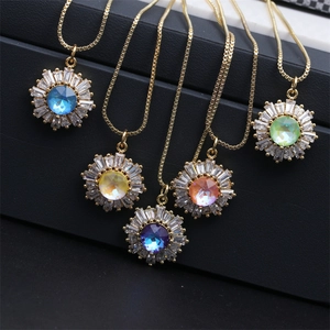Detail showing five colorful sunflower necklaces in gold finish on black background