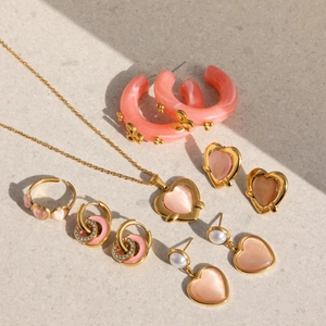 Pink heart jewelry set with 18K gold earrings, necklace, and ring in sweet elegant style