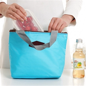 Waterproof sky blue insulated lunch bag with gray handles for picnics and meals