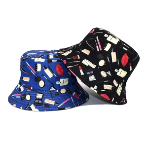 Detailed view of cosmetic print bucket hats in black and blue with perfume pattern