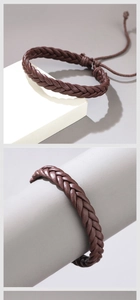 Close-up of brown braided leather bracelet featuring adjustable drawstring closure detail