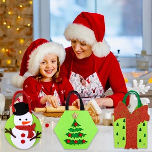 Three festive felt Christmas gift bags with snowman, tree and bow designs in holiday setting