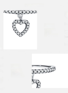 Detailed view of S925 sterling silver ring with dangling heart charm and 5A cubic zirconia