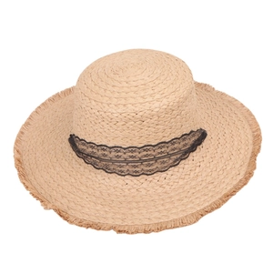 Summer wide brim straw sun hat with black lace ribbon and fringed edges on white background