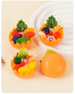 Detailed close-up of miniature fruit bowl charms featuring berries and orange slices