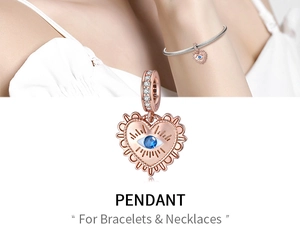 Rose gold heart pendant with blue evil eye stone and micro-inlaid crystals for jewelry