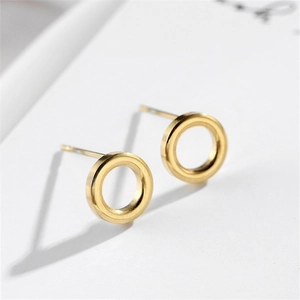 Macro view showing the polished 18k gold geometric hollow round earrings for women