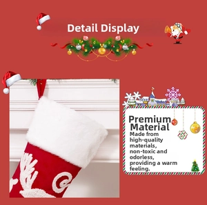 Close-up of red velvet Christmas stocking with 3D reindeer embroidery and white faux fur trim