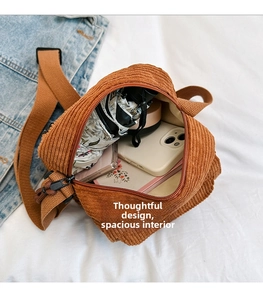 Caramel corduroy crossbody bag interior view showing large capacity for daily items