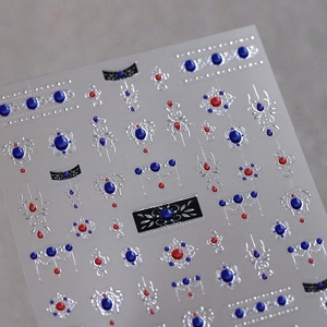 3D embossed nail stickers featuring red and blue faux gems with silver metallic lines
