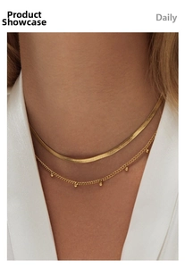 Close-up of 18K gold plated stainless steel snake chain and beaded necklace set