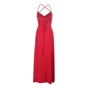 Detail of red floor-length dress featuring criss-cross back straps and an open back design