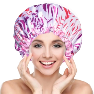 Detail of floral print double-layer waterproof satin shower cap on smiling model