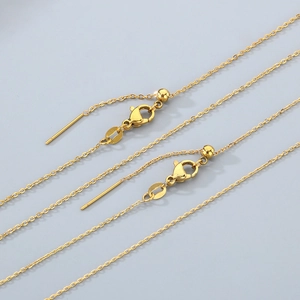 Detail of adjustable 18K gold plated stainless steel chain with lobster clasp and slider bead