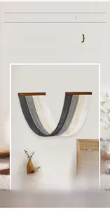 Detail of hand woven bohemian wall tapestry featuring a U-shaped gradient fringe design