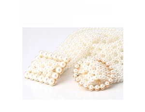 Detail showing elegant white pearl woven belt with circular and square pearl-studded buckles