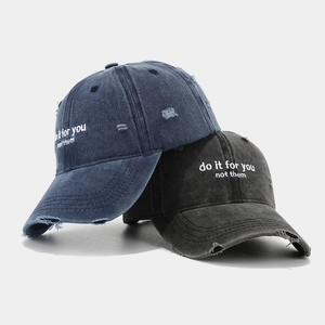 Vintage washed cotton baseball caps with distressed holes and motivational embroidery