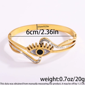 Detail showing dimensions of golden stainless steel evil eye cuff with crystal inlay