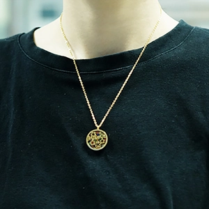 18K gold plated hollow circular pendant necklace with colorful gemstones on model