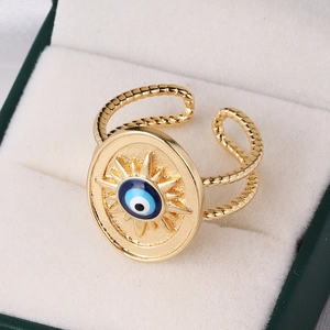 Vintage evil eye sun ring in gold finish with blue enamel on a jewelry display box