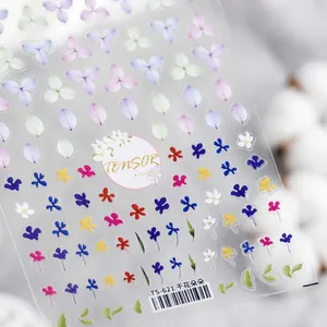 Macro detail of 3D embossed floral nail art stickers with dried flower patterns