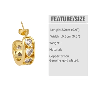 Detail view of gold heart earrings with cubic zirconia, size 2.2cm x 0.8cm on white background