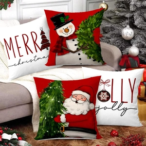 Set of 4 festive Christmas pillow covers with Santa and Snowman on a cozy sofa