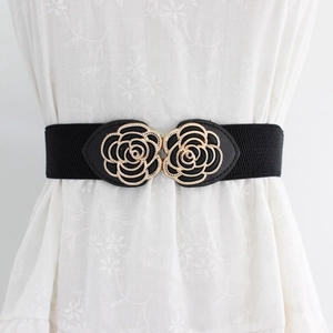 Women elastic waist belt with gold rose flower buckle on floral dress for elegant look