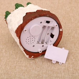 Detail view of the battery compartment and three-way switch on the resin base
