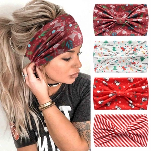 Detail view showing four festive Christmas patterns on wide yoga elastic headbands