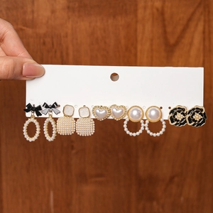 Elegant 6-pair gold plated earring set with black bows, pearls and floral heart designs