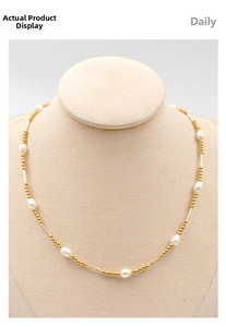Detail of French vintage freshwater pearl necklace with gold-plated titanium steel beads