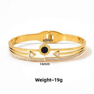 Detail of Roman numeral gold bangle with black enamel, white diamonds and 14mm width size