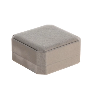 Top-down view of a grey octagonal velvet jewelry box for rings and bracelets